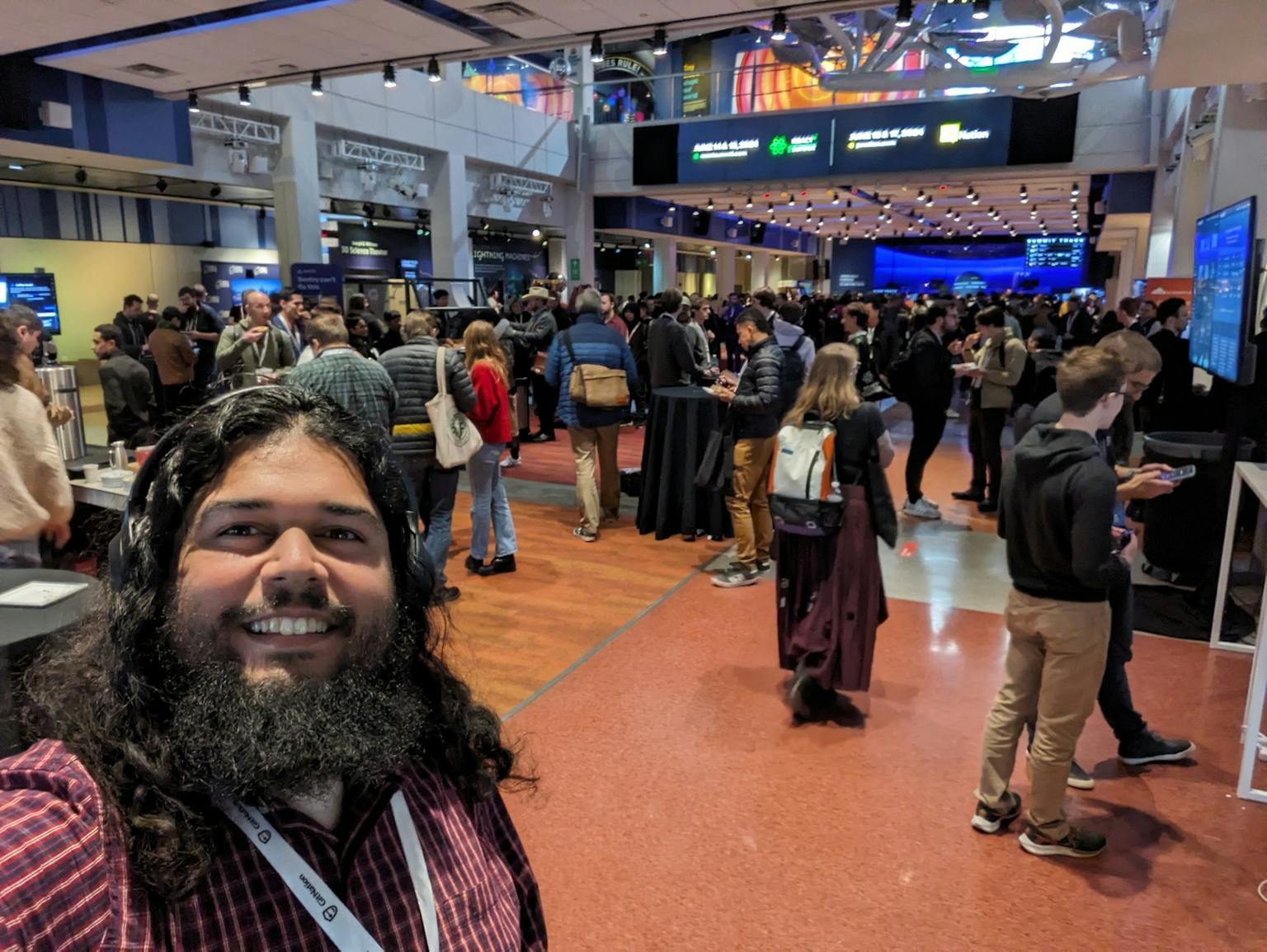 Standing in the center hall at React Summit US while on a work meeting